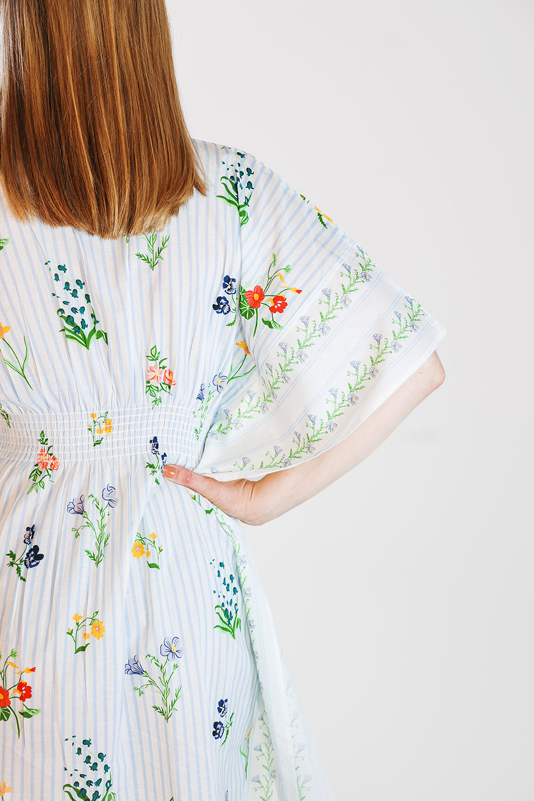 Model in kaftan, sleeve closeup