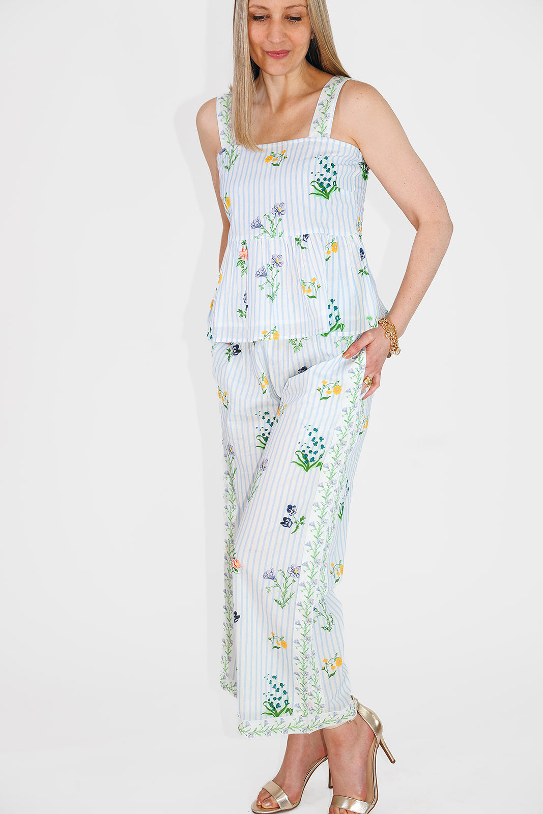 model in peplum top and matching pants
