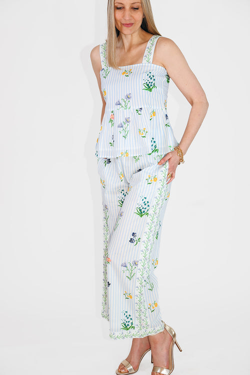model in peplum top and matching pants