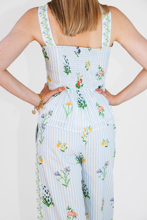 model in peplum top and matching pants